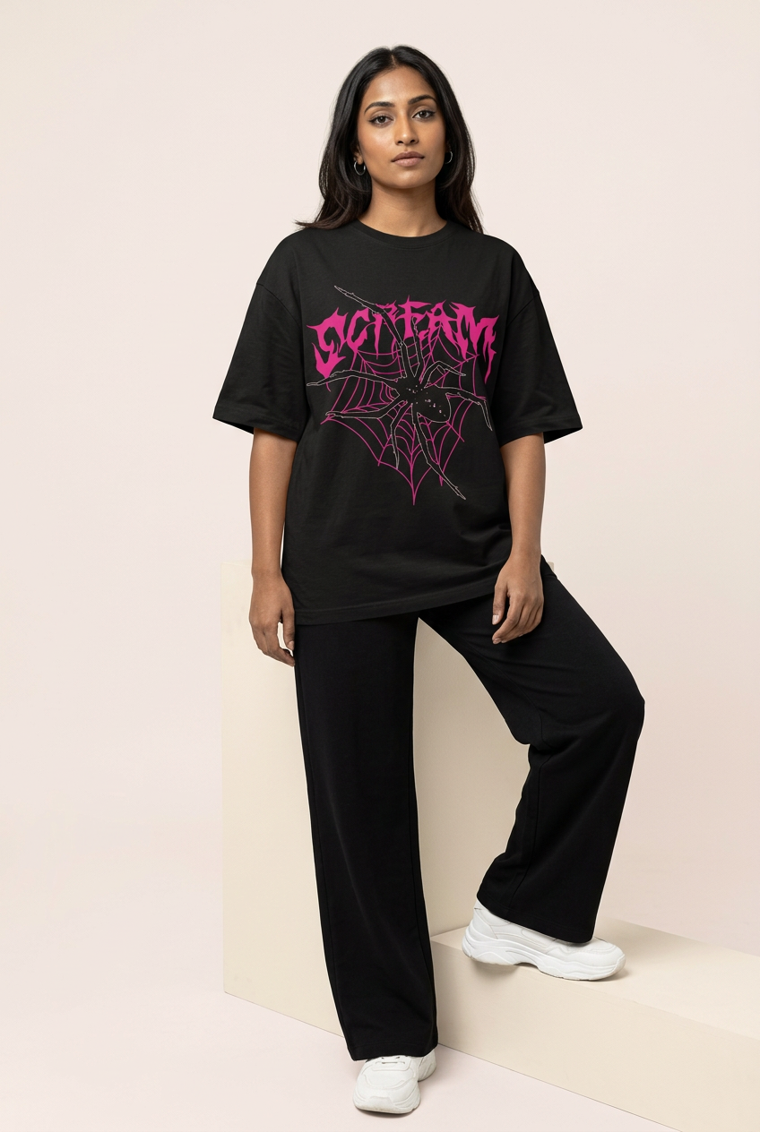 Indian female model in gothic spiderweb tee with black wide-leg trousers