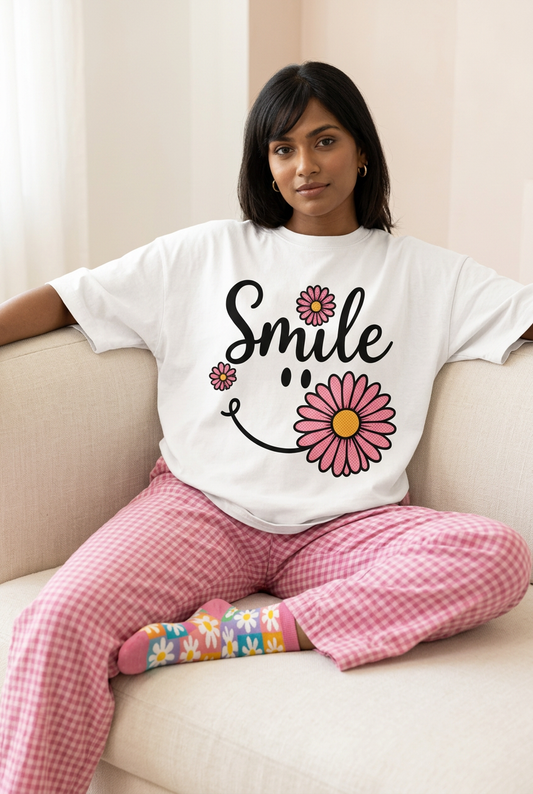 Smile daisy tee with checked pajamas and mismatched flower socks