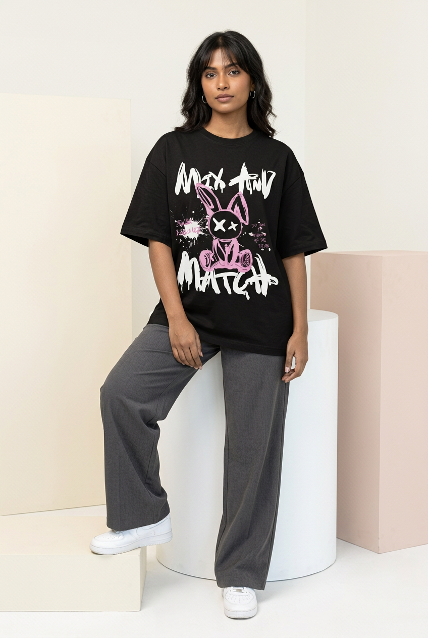 Indian female model in pink rabbit tee with charcoal wide-leg trousers