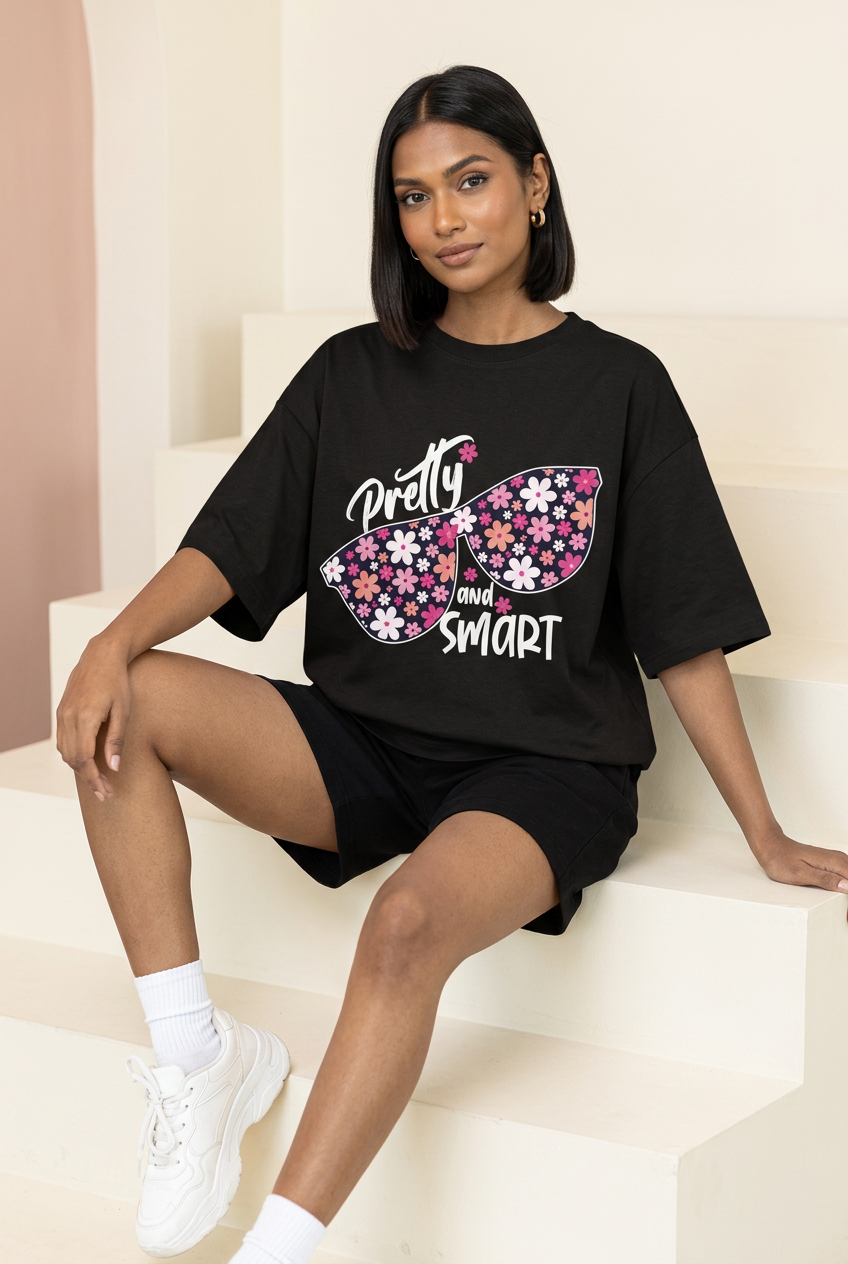 Indian female model in floral sunglasses tee with black shorts and white sneakers