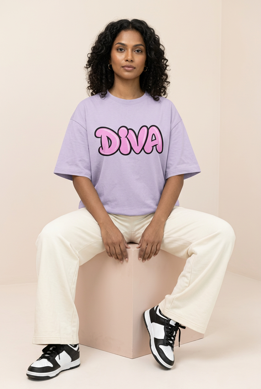 Pink Diva tee with cream wide-leg trousers, seated Indian model