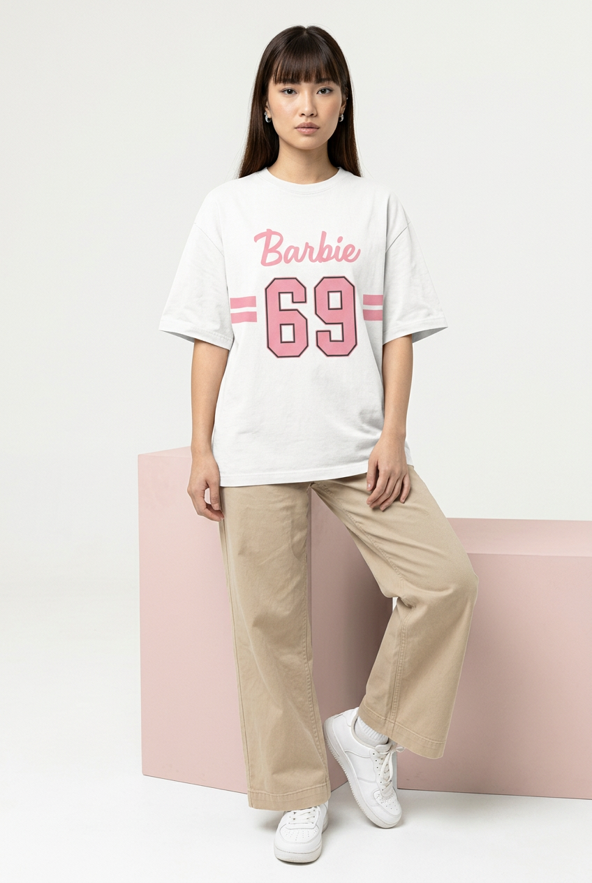 Pink varsity oversized tee with beige wide-leg trousers