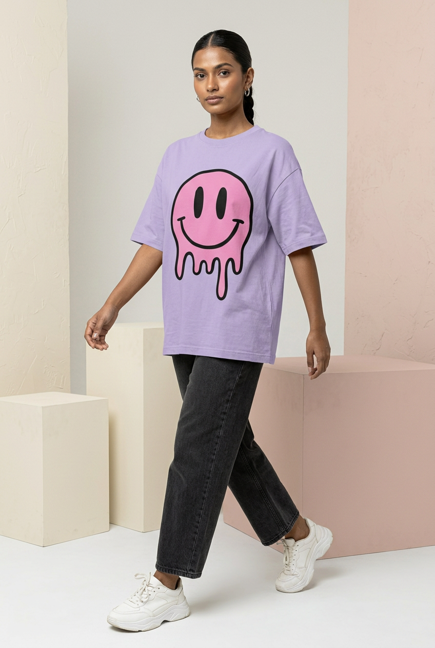 Indian female model in lavender pink dripping smiley tee with charcoal jeans