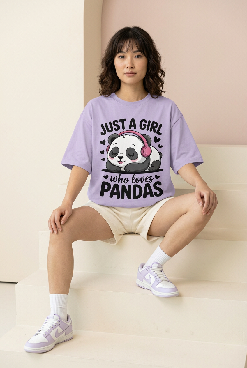 Lavender panda oversized tee, model seated on studio steps