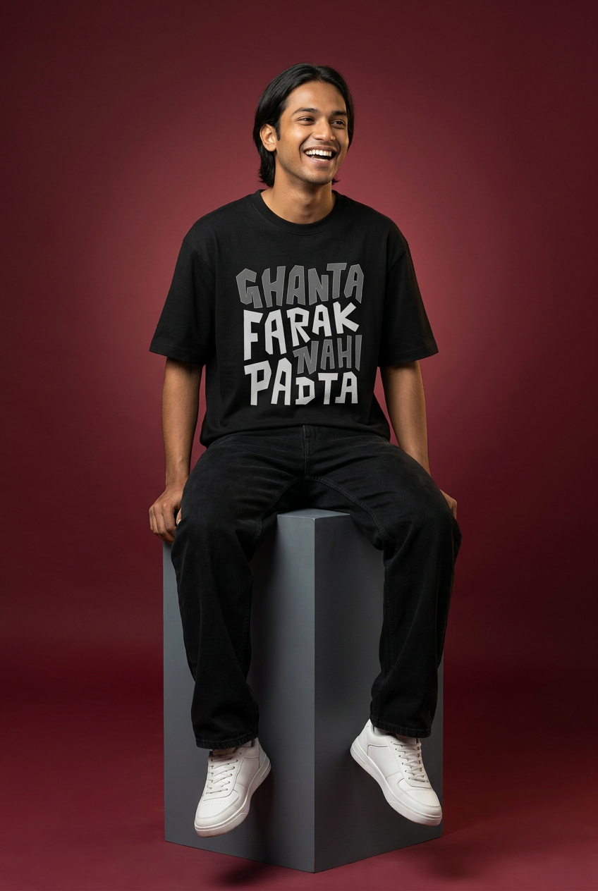 Ghanta Farak oversized T-shirt, Indian Gen Z model, tall-cube seated pose