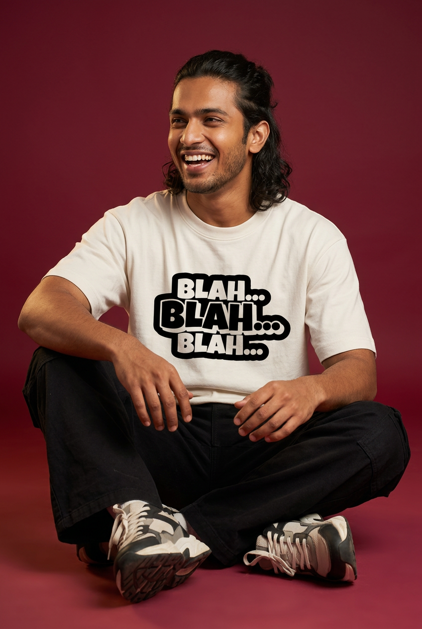 Blah tee, Indian Gen Z model, cross-legged seated pose