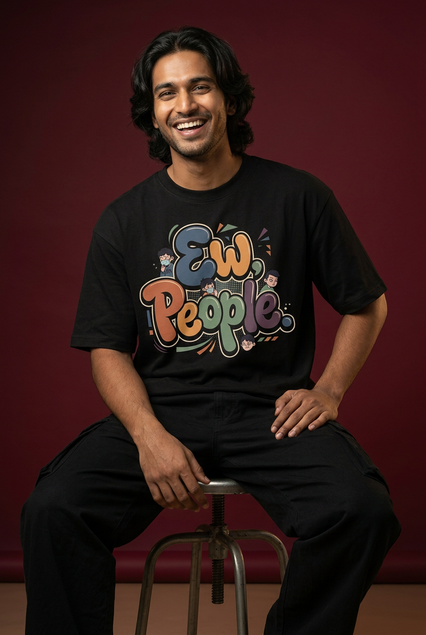 EWW oversized T-shirt, long-haired model, laughing seated pose
