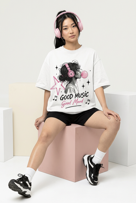 White Good Music Good Mood oversized tee, seated model with headphones