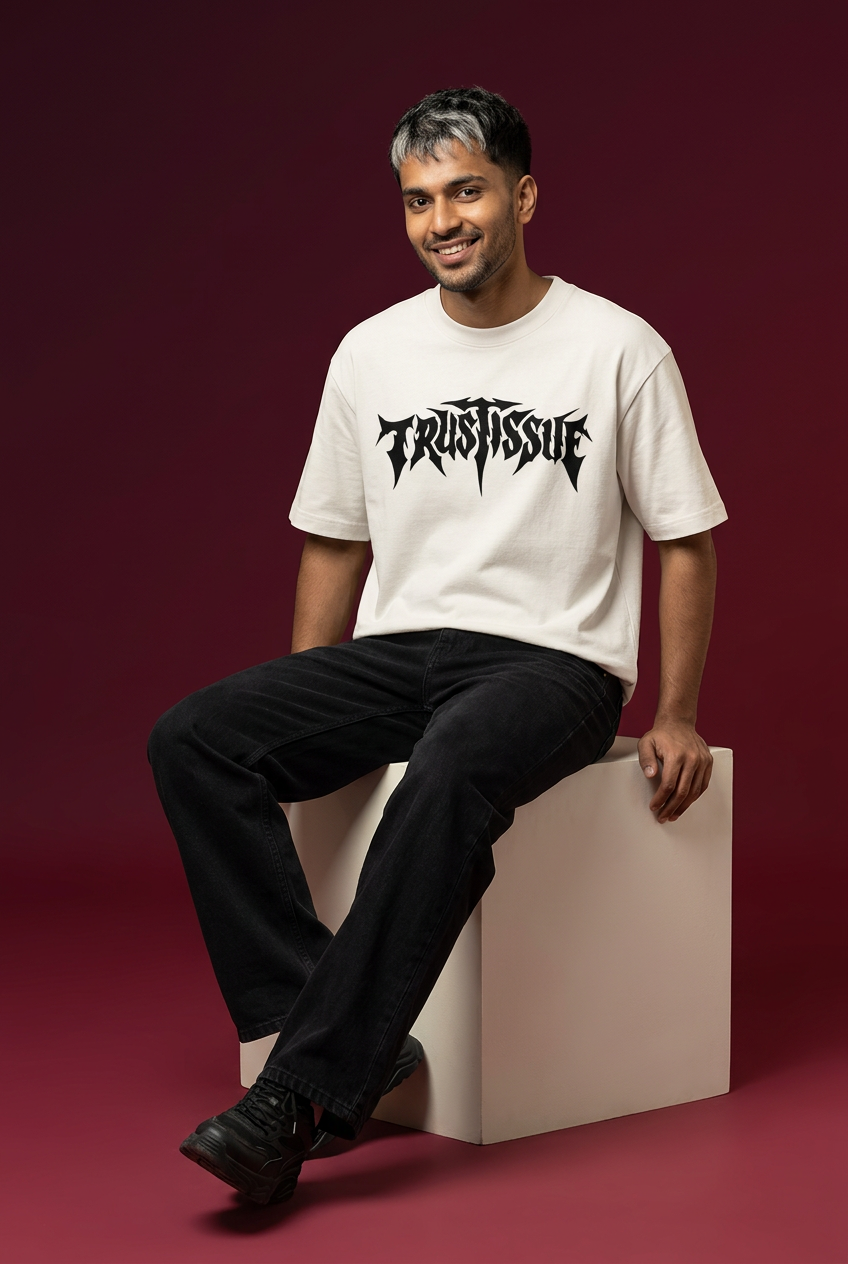 Issue oversized T-shirt, Indian Gen Z model, seated cube pose