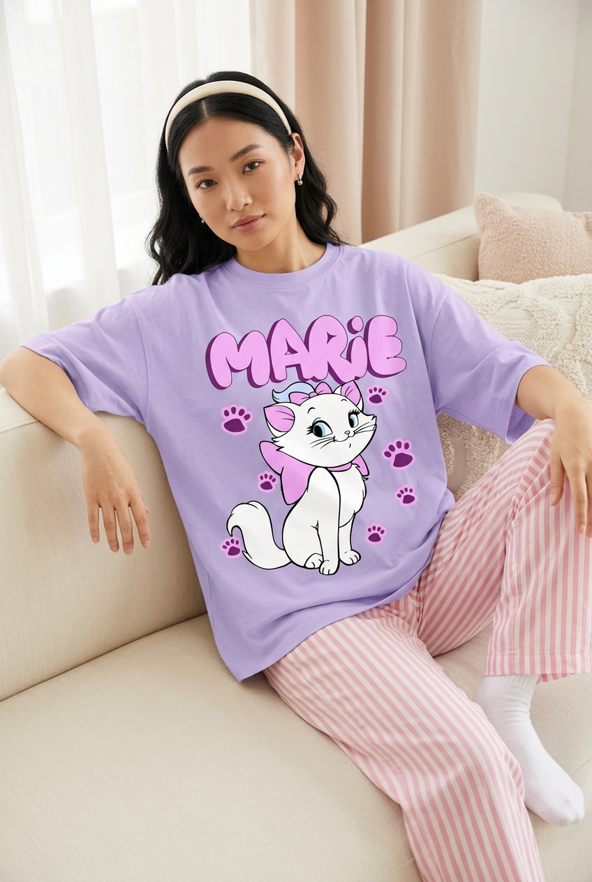 Lavender Marie tee with striped pajama pants, relaxed sofa pose