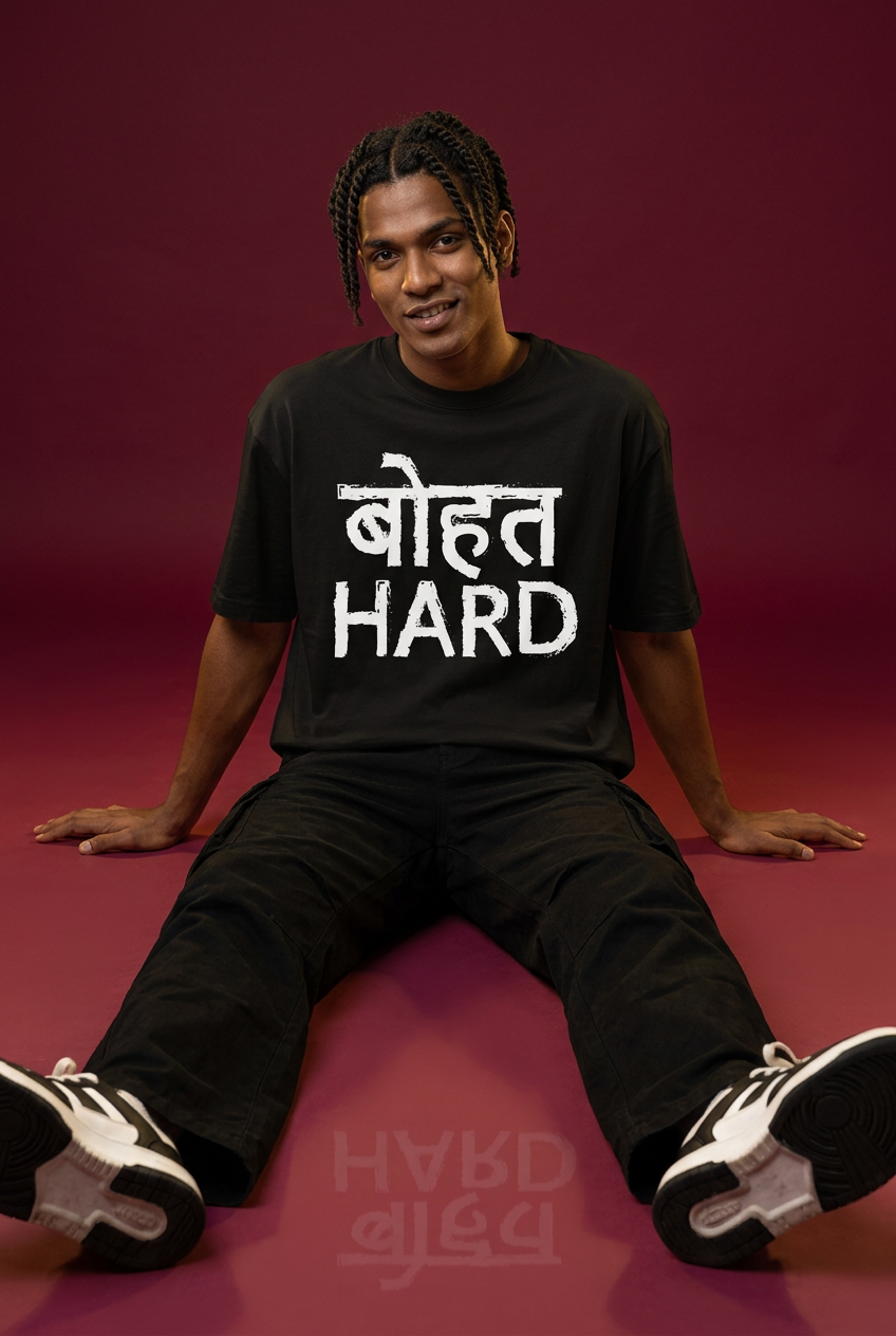 Hard oversized T-shirt, Indian Gen Z model, floor-seated pose