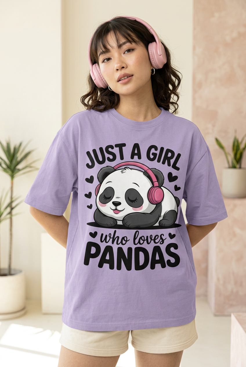 Panda oversized tee, high-angle model portrait with pink headphones