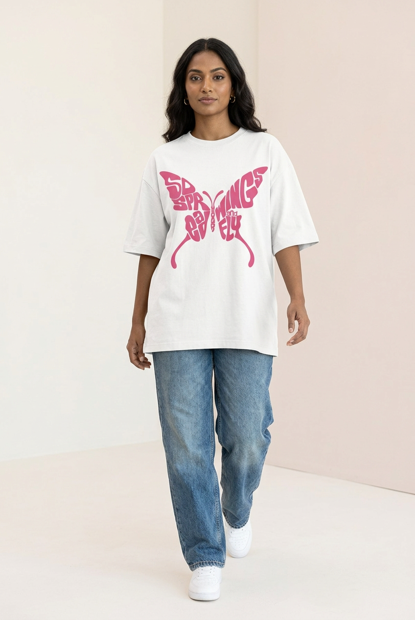 Indian female model in white pink butterfly typography tee with blue jeans